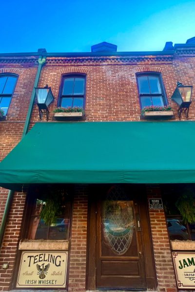 Brick Building With Entry Door To McGurks